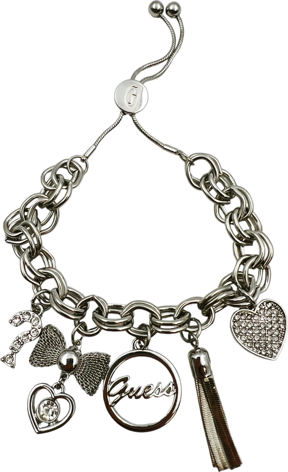 Bracelet Guess en métal doré à breloques serties de zircon, référence 109798, pour femme